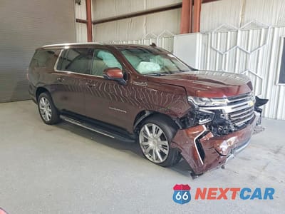 Czwarte zdjęcie samochodu z boku: 2023 CHEVROLET SUBURBAN K1500 HIGH COUNTRY VIN:1GNSKGKT2PR316922 - miniatura