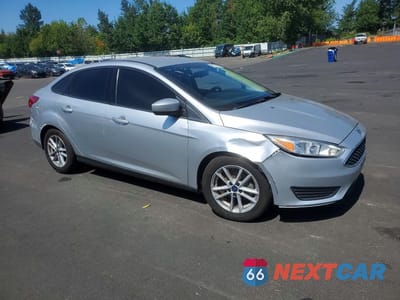 Czwarte zdjęcie samochodu z boku: 2018 FORD FOCUS SE VIN:1FADP3F27JL237470 - miniatura