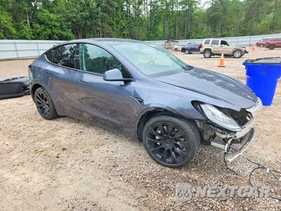 Czwarte zdjęcie samochodu z boku: 2023 TESLA MODEL Y VIN:7SAYGDEE3PA042930 - miniatura