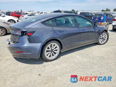 Trzecie zdjęcie samochodu z tyłu: 2021 TESLA MODEL 3 VIN:5YJ3E1EA7MF096609 - miniatura
