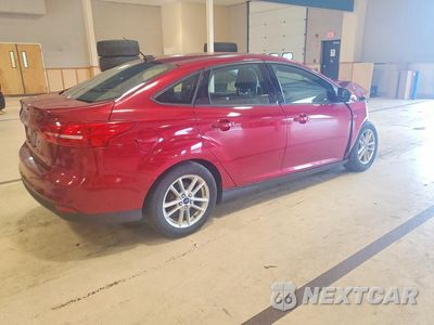 Trzecie zdjęcie samochodu z tyłu: 2016 FORD FOCUS SE VIN:1FADP3F29GL206696 - miniatura