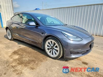 Czwarte zdjęcie samochodu z boku: 2023 TESLA MODEL 3 VIN:5YJ3E1EAXPF446710 - miniatura
