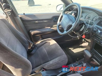 Zdjęcie 7 z 12 samochodu: 1994 TOYOTA COROLLA DX VIN:1NXAE09B2RZ193165 - miniatura