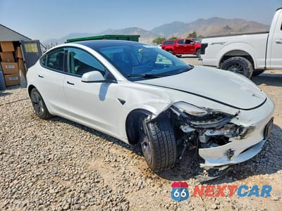 Czwarte zdjęcie samochodu z boku: 2023 TESLA MODEL 3 VIN:5YJ3E1EA3PF456687 - miniatura