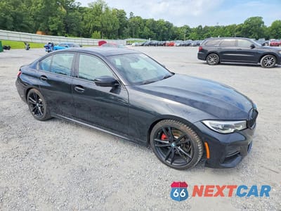 Czwarte zdjęcie samochodu z boku: 2021 BMW 330I VIN:3MW5R1J09M8C02599 - miniatura