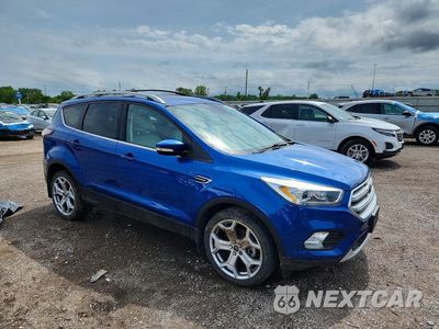 Czwarte zdjęcie samochodu z boku: 2017 FORD ESCAPE TITANIUM VIN:1FMCU9J99HUC44233 - miniatura