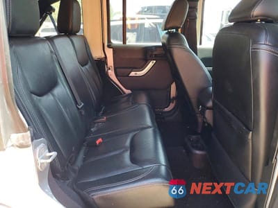 Zdjęcie 11 z 13 samochodu: 2013 JEEP WRANGLER UNLIMITED SAHARA VIN:1C4BJWEGXDL548221 - miniatura
