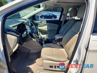 Zdjęcie 7 z 12 samochodu: 2014 FORD ESCAPE TITANIUM VIN:1FMCU0J94EUE20287 - miniatura