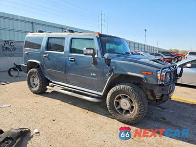 Czwarte zdjęcie samochodu z boku: 2005 HUMMER H2 VIN:5GRGN23U15H116518 - miniatura