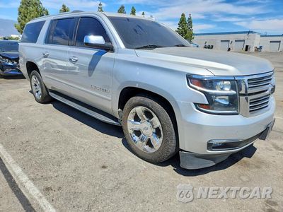 Czwarte zdjęcie samochodu z boku: 2017 CHEVROLET SUBURBAN K1500 PREMIER VIN:1GNSKJKCXHR268603 - miniatura