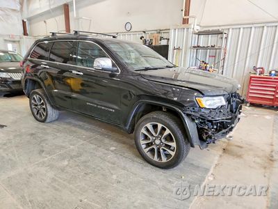 Czwarte zdjęcie samochodu z boku: 2017 JEEP GRAND CHEROKEE OVERLAND VIN:1C4RJFCG4HCH15781 - miniatura