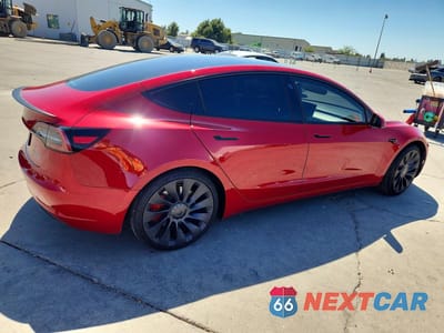 Trzecie zdjęcie samochodu z tyłu: 2023 TESLA MODEL 3 VIN:5YJ3E1EC5PF461178 - miniatura