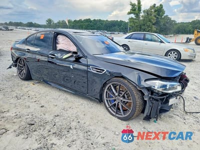 Czwarte zdjęcie samochodu z boku: 2016 BMW M5 VIN:WBSFV9C5XGG343609 - miniatura