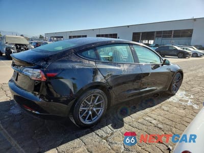 Trzecie zdjęcie samochodu z tyłu: 2023 TESLA MODEL 3 VIN:5YJ3E1EA9PF453390 - miniatura
