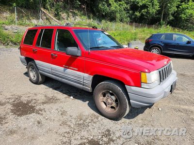 Czwarte zdjęcie samochodu z boku: 1998 JEEP GRAND CHEROKEE LAREDO VIN:1J4GZ58S7WC274370 - miniatura