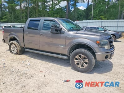 Czwarte zdjęcie samochodu z boku: 2014 FORD F150 SUPERCREW VIN:1FTFW1ET0EFB92672 - miniatura