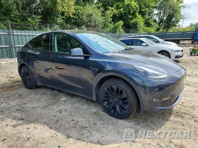 Czwarte zdjęcie samochodu z boku: 2024 TESLA MODEL Y VIN:7SAYGAEE9RF020807 - miniatura