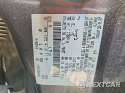 Zdjęcie 12 z 12 samochodu: 2014 FORD FOCUS TITANIUM VIN:1FADP3J28EL321651 - miniatura