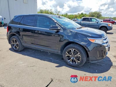 Czwarte zdjęcie samochodu z boku: 2014 FORD EDGE LIMITED VIN:2FMDK4KC2EBA54637 - miniatura