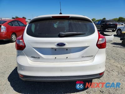 Zdjęcie 6 z 13 samochodu: 2014 FORD FOCUS TITANIUM VIN:1FADP3N21EL281729 - miniatura