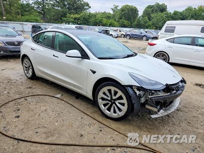 Czwarte zdjęcie samochodu z boku: 2022 TESLA MODEL 3 VIN:5YJ3E1EB5NF289738 - miniatura
