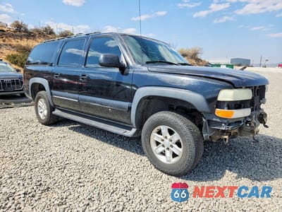 Czwarte zdjęcie samochodu z boku: 2001 CHEVROLET SUBURBAN K1500 VIN:3GNFK16TX1G209763 - miniatura