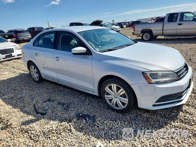 Czwarte zdjęcie samochodu z boku: 2017 VOLKSWAGEN JETTA S VIN:3VW2B7AJ1HM401999 - miniatura