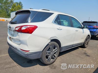 Trzecie zdjęcie samochodu z tyłu: 2021 CHEVROLET EQUINOX LT VIN:2GNAXKEV3M6100436 - miniatura