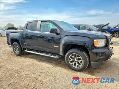 Czwarte zdjęcie samochodu z boku: 2016 GMC CANYON SLE VIN:1GTP6CE10G1277347 - miniatura