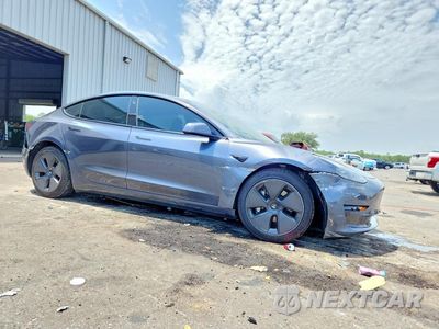 Czwarte zdjęcie samochodu z boku: 2023 TESLA MODEL 3 VIN:5YJ3E1EA2PF517429 - miniatura