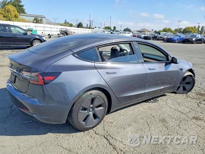 Trzecie zdjęcie samochodu z tyłu: 2023 TESLA MODEL 3 VIN:5YJ3E1EA9PF648700 - miniatura