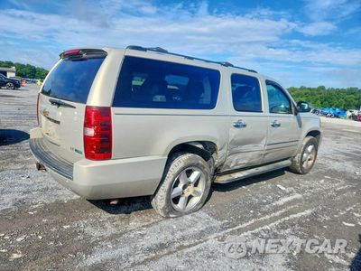 Trzecie zdjęcie samochodu z tyłu: 2011 CHEVROLET SUBURBAN K1500 LTZ VIN:1GNSKKE3XBR365812 - miniatura