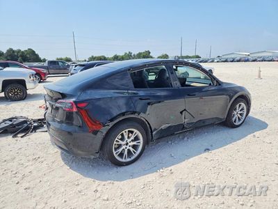 Trzecie zdjęcie samochodu z tyłu: 2023 TESLA MODEL Y VIN:7SAYGDEE8PA047637 - miniatura