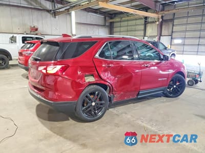 Trzecie zdjęcie samochodu z tyłu: 2018 CHEVROLET EQUINOX PREMIER VIN:2GNAXVEV8J6263614 - miniatura
