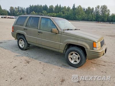 Czwarte zdjęcie samochodu z boku: 1998 JEEP GRAND CHEROKEE LAREDO VIN:1J4FX48S3WC236243 - miniatura