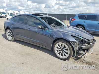 Czwarte zdjęcie samochodu z boku: 2022 TESLA MODEL 3 VIN:5YJ3E1EA2NF336828 - miniatura