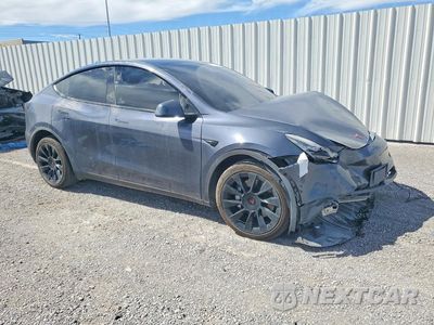 Czwarte zdjęcie samochodu z boku: 2022 TESLA MODEL Y VIN:7SAYGDEE9NF494882 - miniatura