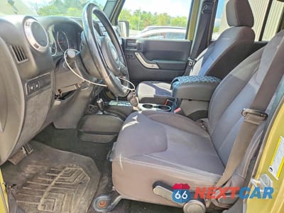 Zdjęcie 7 z 12 samochodu: 2013 JEEP WRANGLER UNLIMITED RUBICON VIN:1C4HJWFG5DL561032 - miniatura