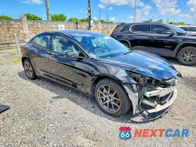 Czwarte zdjęcie samochodu z boku: 2023 TESLA MODEL 3 VIN:5YJ3E1EA4PF458903 - miniatura