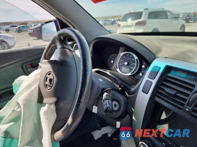 Zdjęcie 9 z 12 samochodu: 2007 HYUNDAI TUCSON SE VIN:KM8JN72D47U528086 - miniatura