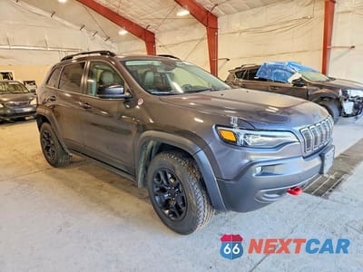 Czwarte zdjęcie samochodu z boku: 2022 JEEP CHEROKEE TRAILHAWK VIN:1C4PJMBXXND553025 - miniatura