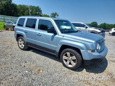 Czwarte zdjęcie samochodu z boku: 2014 JEEP PATRIOT LATITUDE VIN:1C4NJPFA2ED541157 - miniatura