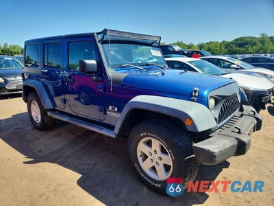 Czwarte zdjęcie samochodu z boku: 2009 JEEP WRANGLER UNLIMITED X VIN:1J8GA39159L729558 - miniatura