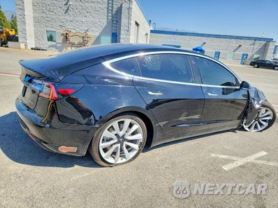 Trzecie zdjęcie samochodu z tyłu: 2019 TESLA MODEL 3 VIN:5YJ3E1EB4KF453475 - miniatura