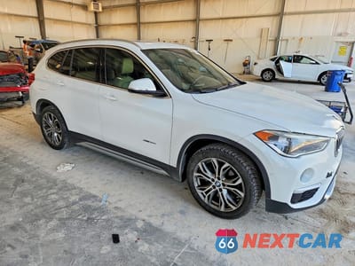 Czwarte zdjęcie samochodu z boku: 2017 BMW X1 VIN:WBXHT3Z35H4A53635 - miniatura