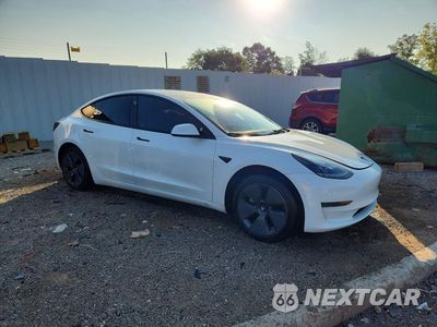 Czwarte zdjęcie samochodu z boku: 2023 TESLA MODEL 3 VIN:5YJ3E1EAXPF458405 - miniatura