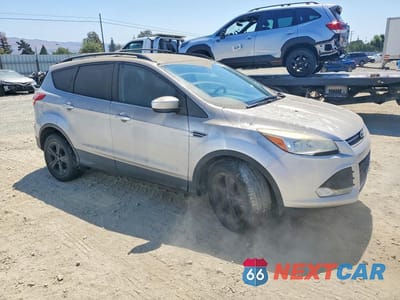 Czwarte zdjęcie samochodu z boku: 2014 FORD ESCAPE SE VIN:1FMCU0GX3EUA85044 - miniatura