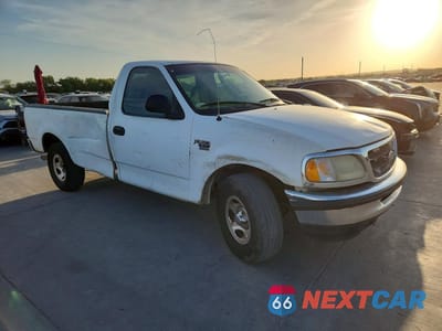 Czwarte zdjęcie samochodu z boku: 2000 FORD F150 VIN:1FTRF17WXYNB21011 - miniatura