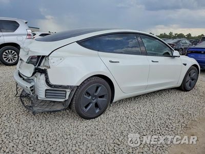 Trzecie zdjęcie samochodu z tyłu: 2023 TESLA MODEL 3 VIN:5YJ3E1EA5PF409712 - miniatura