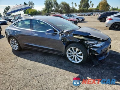 Czwarte zdjęcie samochodu z boku: 2019 TESLA MODEL 3 VIN:5YJ3E1EA6KF401966 - miniatura